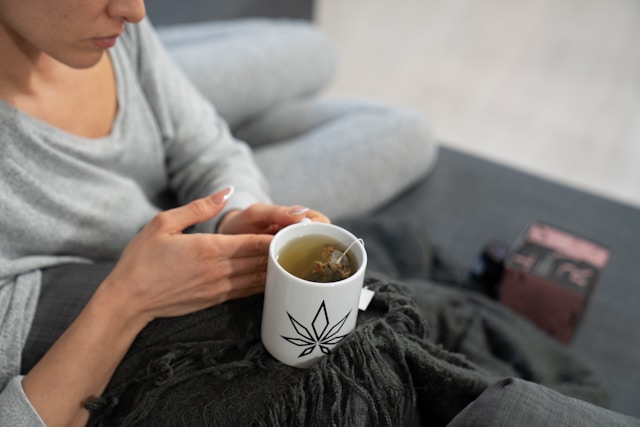 Calm woman with herbal tea and calming evening routine showing how to fall asleep with anxiety