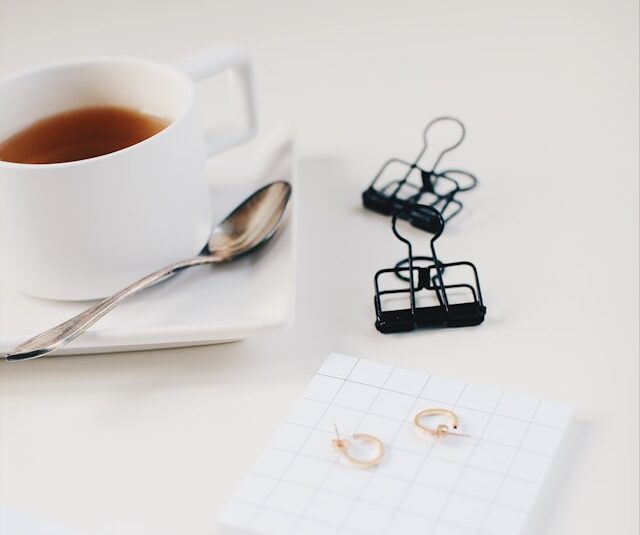 Focused person at desk with green tea demonstrating l-theanine and caffeine stack productivity