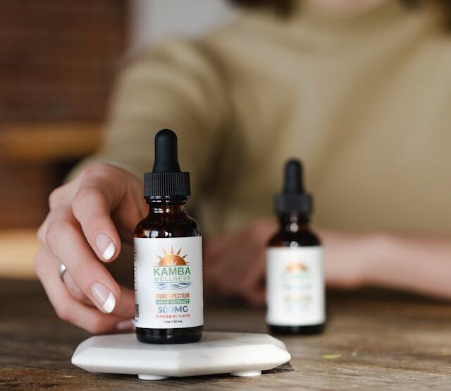 person combining CBG and CBD together for daily wellness routine
