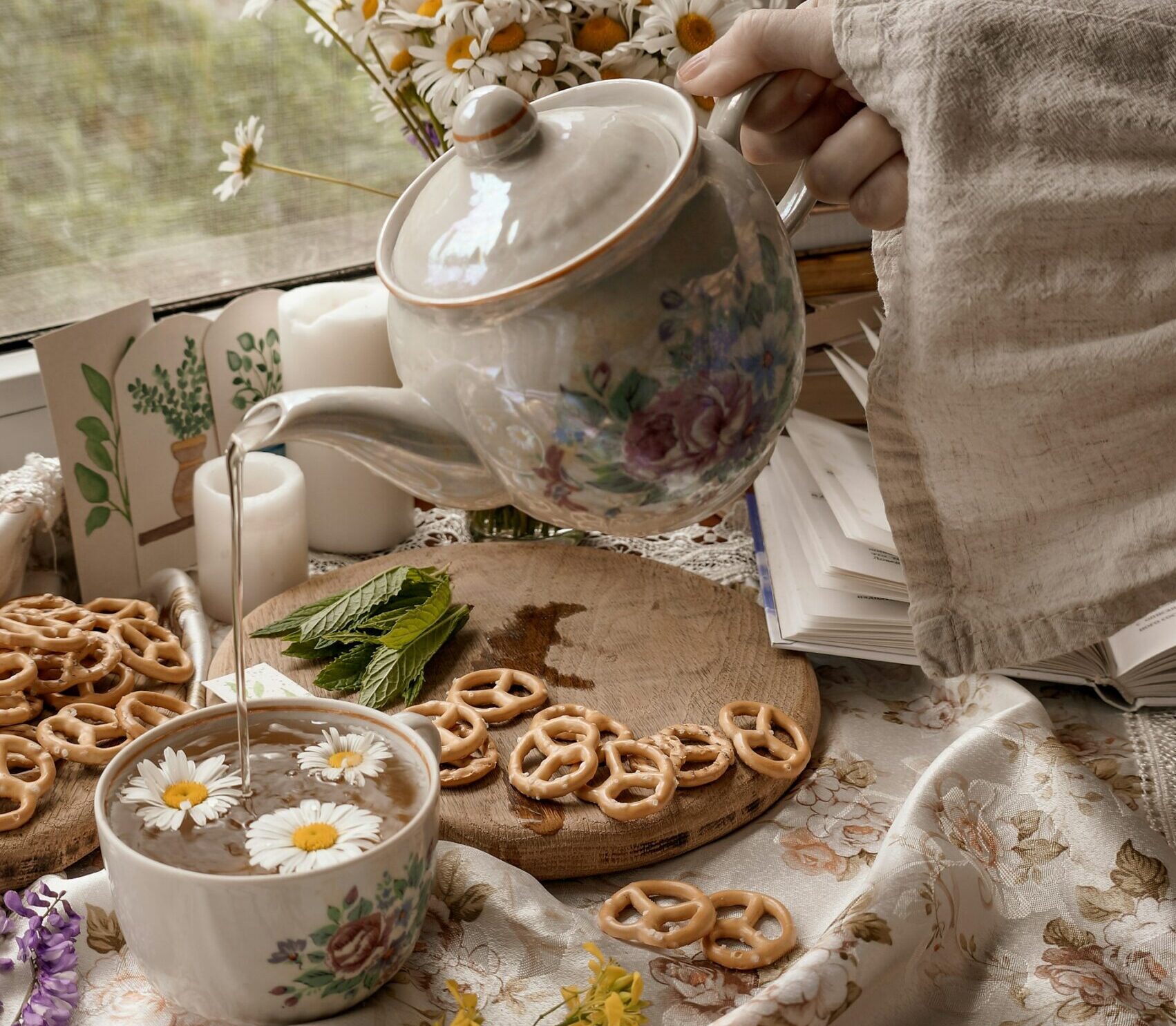 Person with herbal tea enjoying their bedtime routine for better sleep in a cosy evening setting