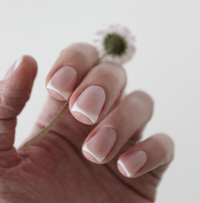 close up comparing smooth and ridged nails on a nail health chart