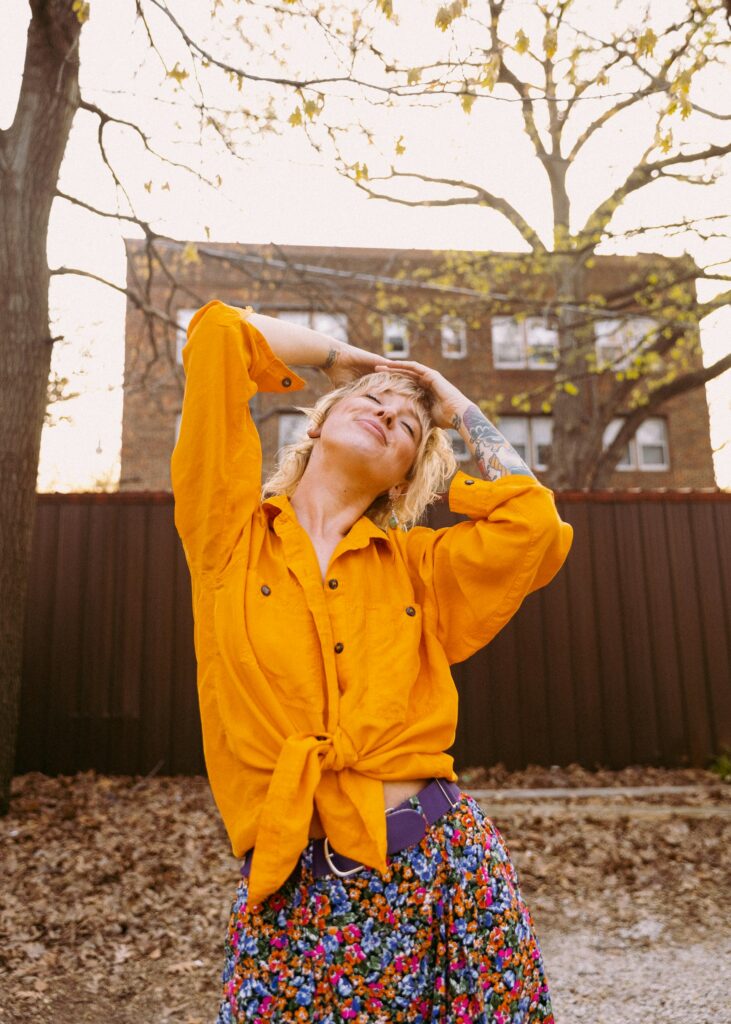 woman wearing bright colourful dopamine dressing outfit bold yellow and pink mood boosting fashion