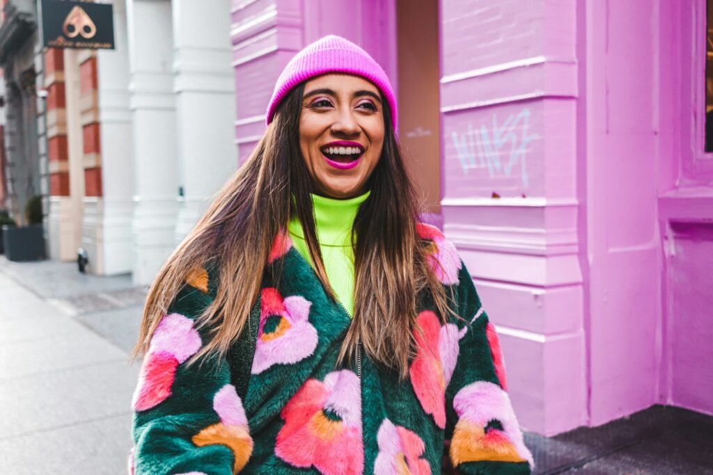 woman wearing bright colourful dopamine dressing outfit bold yellow and pink