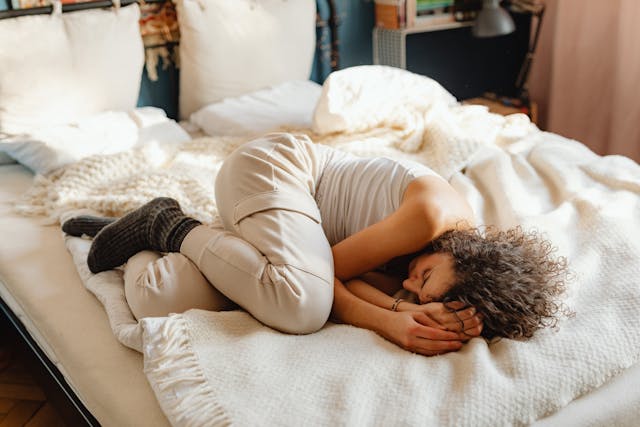 woman experiencing estrogen dominance symptoms including bloating and fatigue