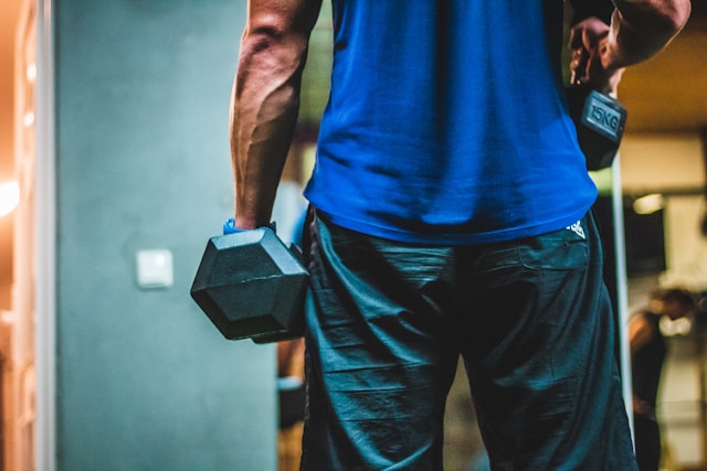 dumbbell back exercises man performing rows for strength and posture