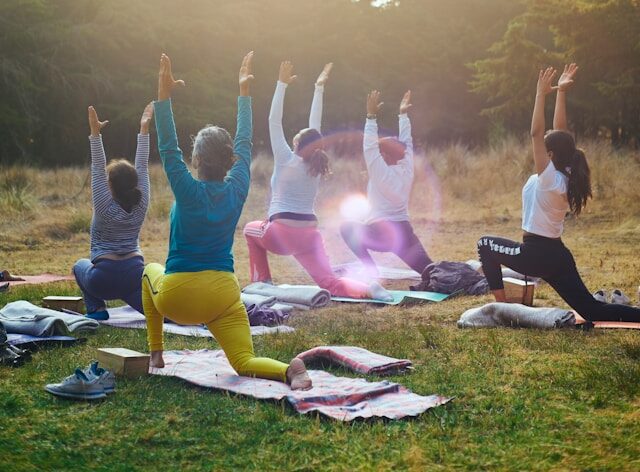 woman doing yoga exercises on mat in mountain pose morning wellness practice